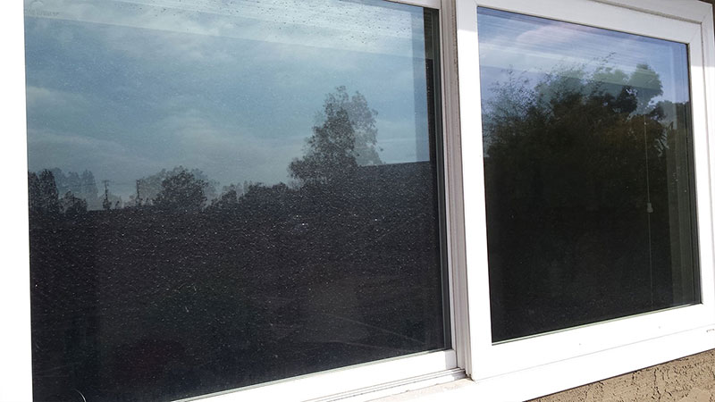 Picture of window before window cleaning in Huntington Beach by Blue Coast Window Cleaning Service
