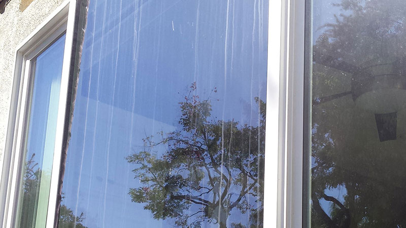 Picture of window before window cleaning in Laguna Niguel by Blue Coast Window Cleaning Service.